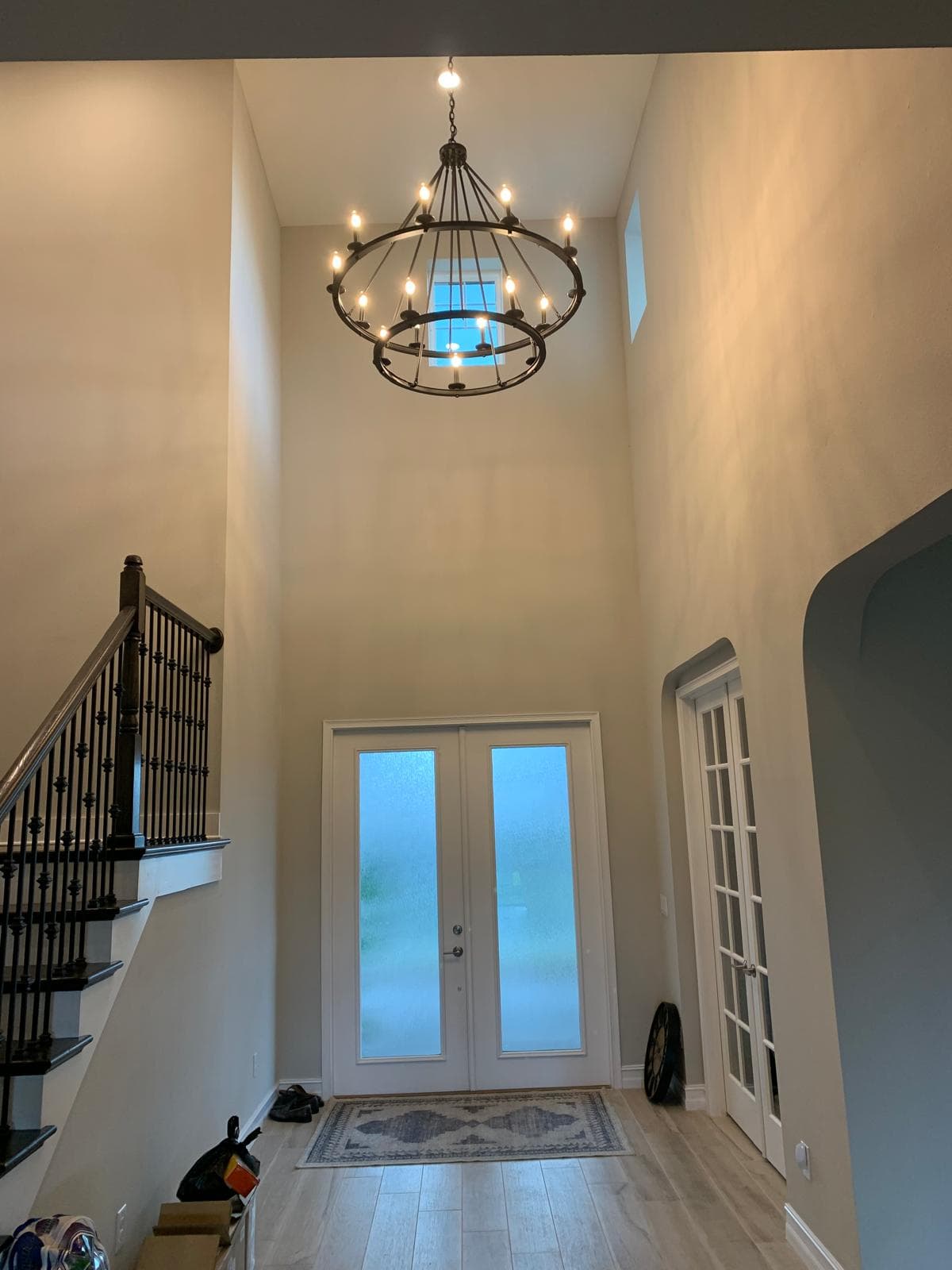 Two-tier chandelier in a two-story foyer
